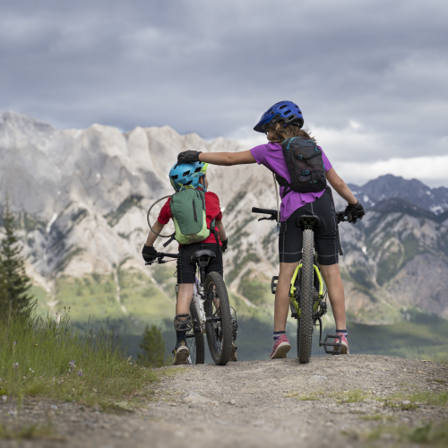 A big sister comforts her little brother on a Trans Canada descend.