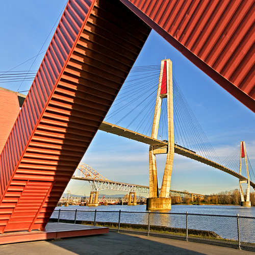 Urban Transportation:  the skytrain and Patullo bridges cross the Fraser River at New Westminster Quay.